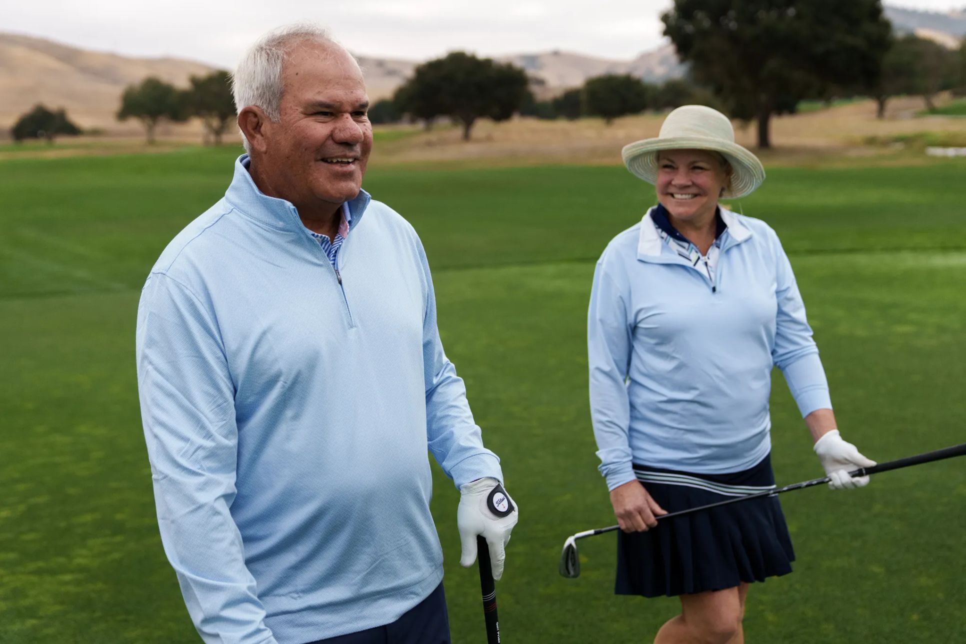 Couple Golfing:Trilogy Homeowners Golfing
