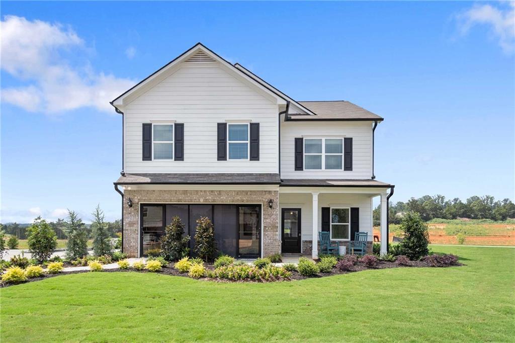 Exterior:View of front of home with a front lawn and a porch