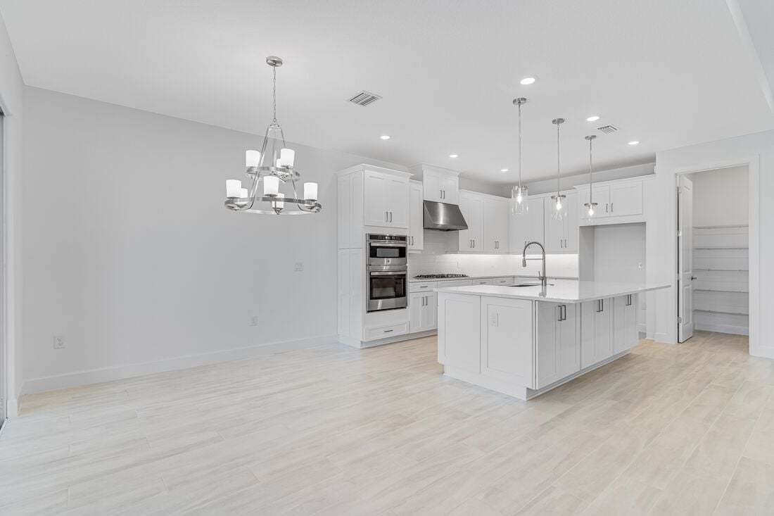 hj-fl-orlando-esplanade-at-center-lake-ranch-azzurro-lot-2-dining-area-to-kitchen-01