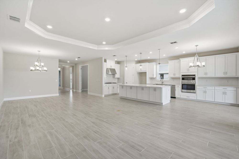 hj-fl-tampa-esplanade-at-wiregrass-ranch-lazio-lot-727-tv-lounge-to-kitchen-001