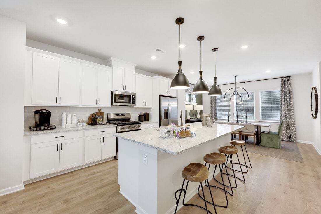 hj-nc-raleigh-buffalo-townes-cobblestone-lot-28-kitchen-to-dining-area-01