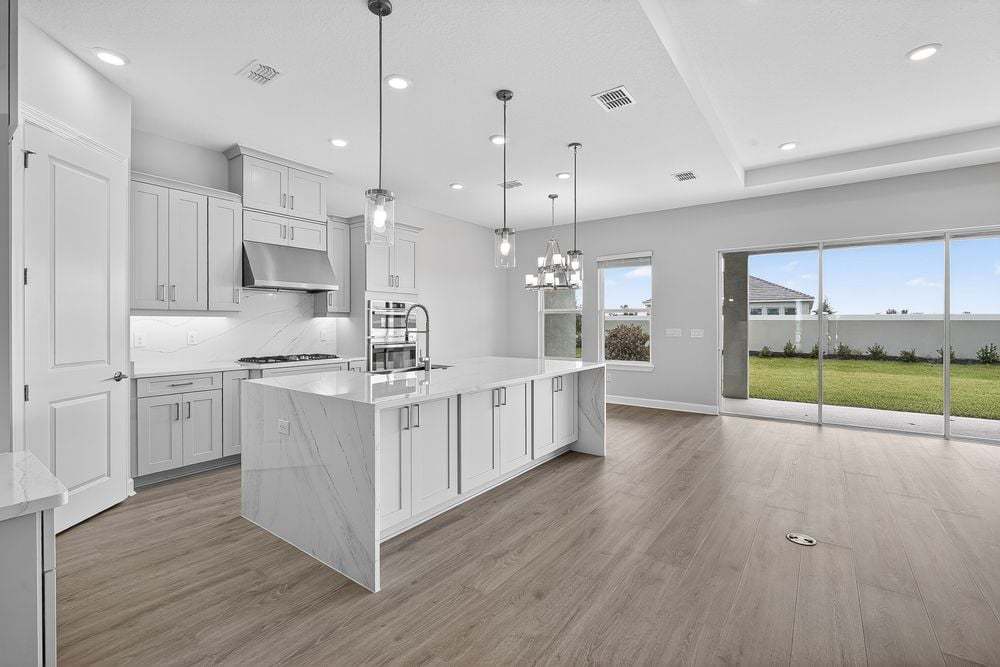 hj-fl-tampa-esplanade-at-coasterra-marino-lot-1123-kitchen-to-dining-area-001