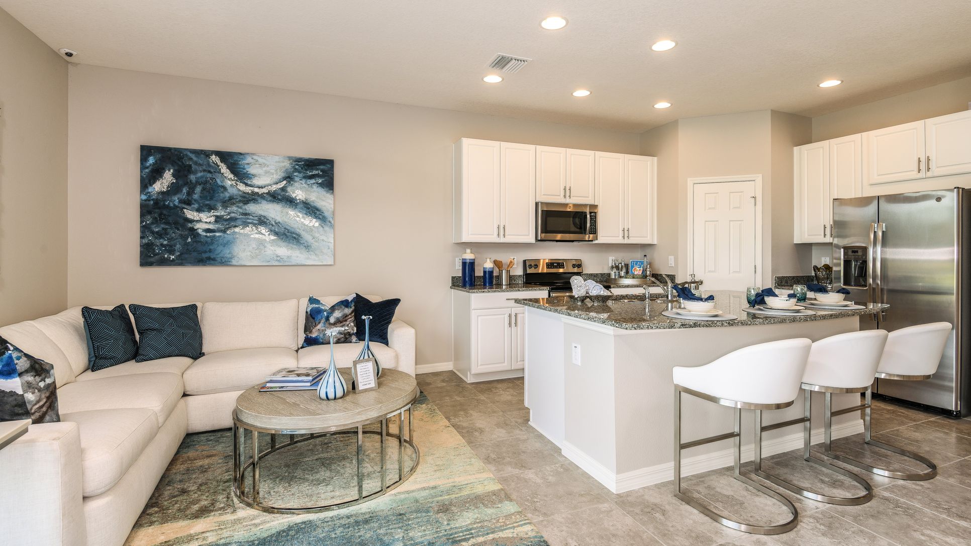 Living room and kitchen, center island with 3 barstools