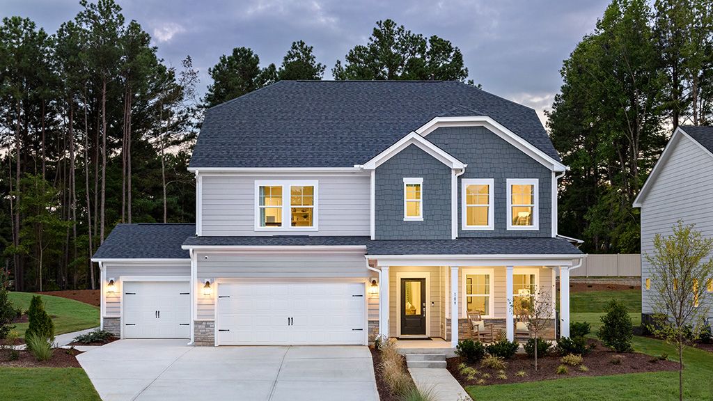 Hamilton Exterior Dusk with Garage Doors:Hamilton Exterior Dusk with Garage Doors