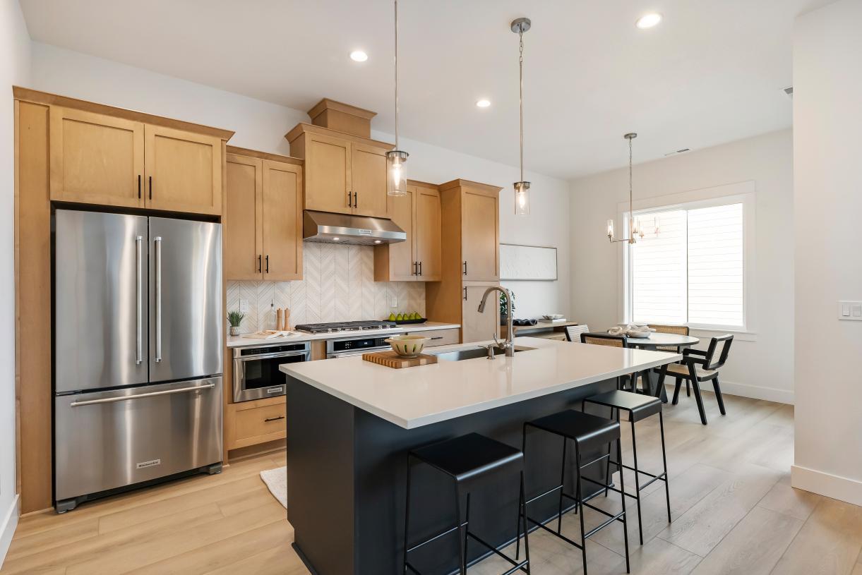 Elevation Image:Well-designed kitchen offers a central island with breakfast bar