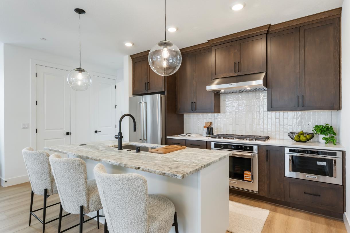 Elevation Image:Well-appointed kitchen combines modern appliances with warm finishes for a welcoming feel
