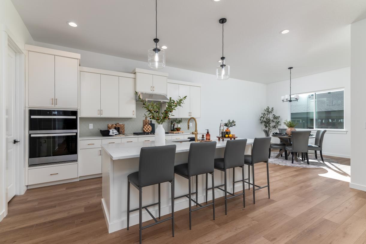 Elevation Image:Gourmet kitchen includes a generous island and abundant cabinetry
