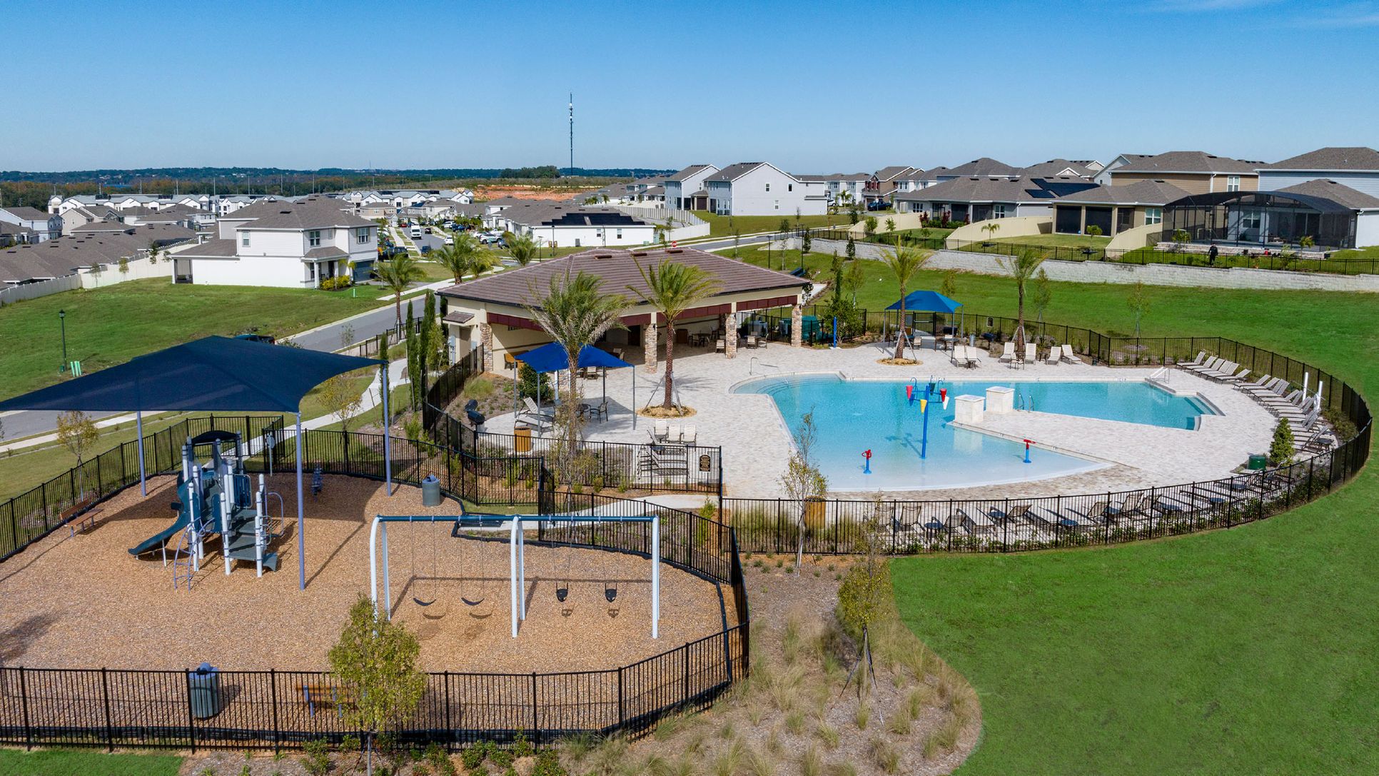 Ridgeview resort-style swimming pool with splash pad and cabana, and a shaded playground:Ridgeview resort-style swimming pool with splash pad and cabana, and a shaded playground