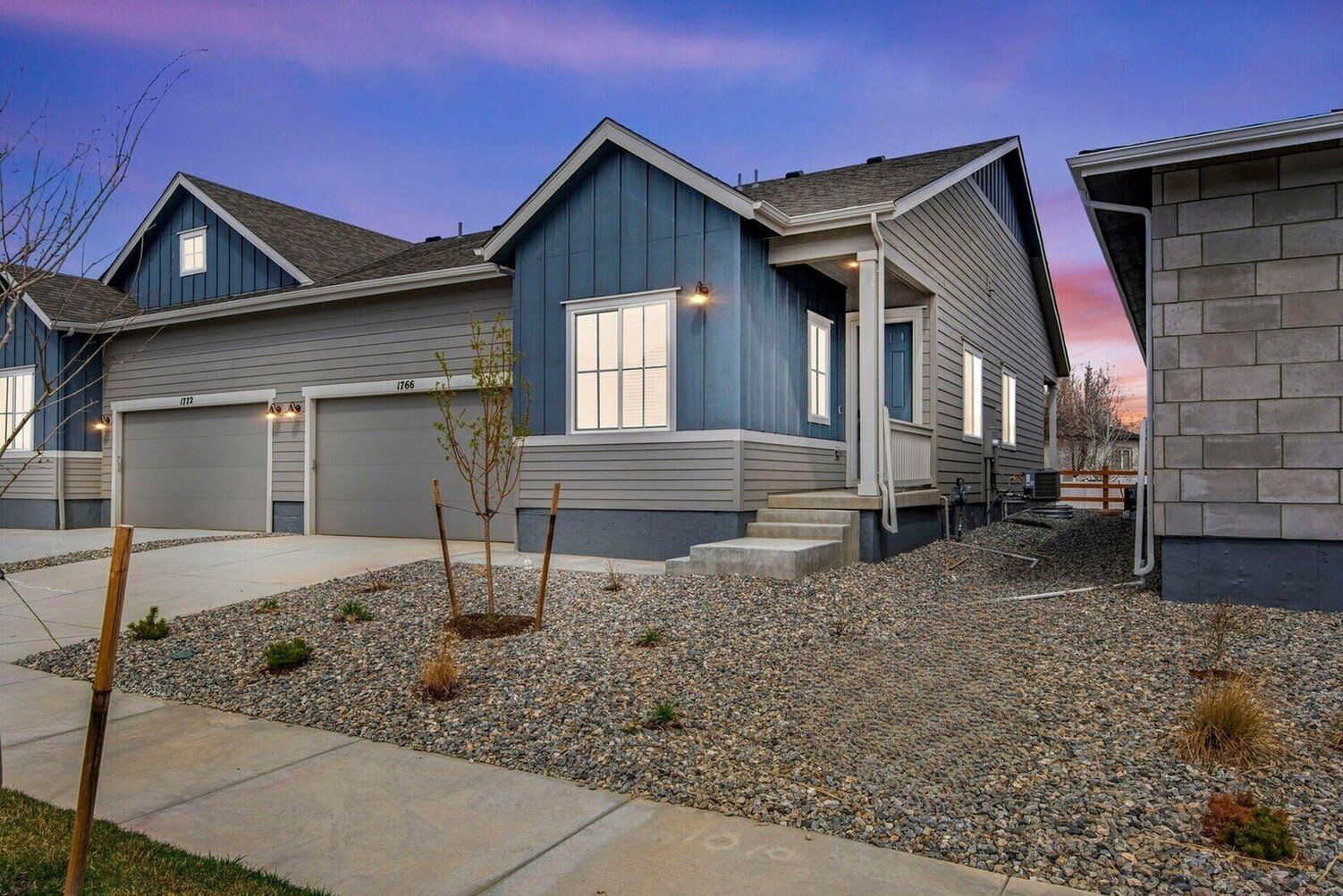 1766 Mount Meeker Avenue:Sleek modern farmhouse exterior, featuring an attached 2-bay garage