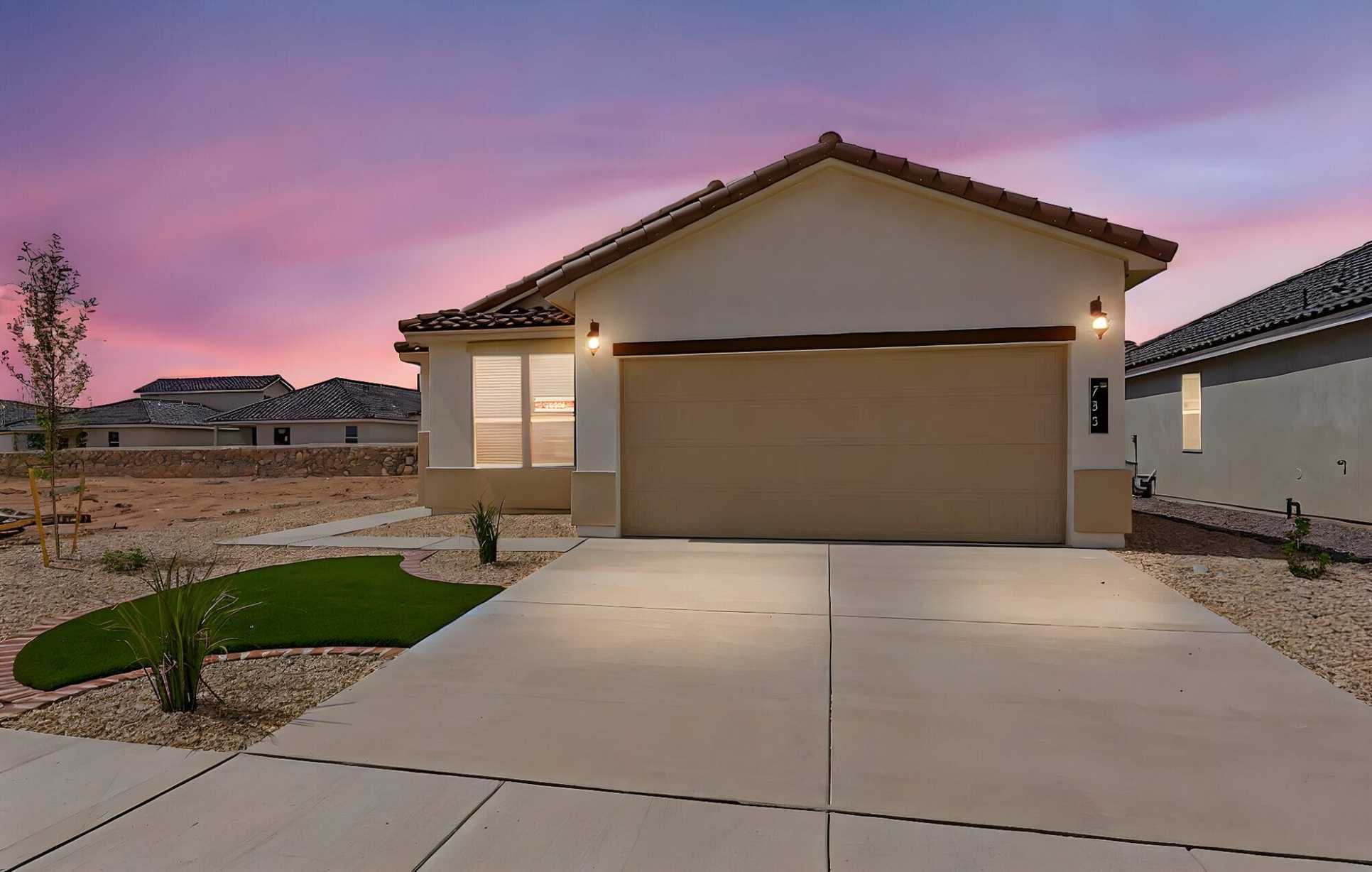 The Desert Willow floorplan showcasing its exterior design and professionally landscaped front yard with rock and turf.