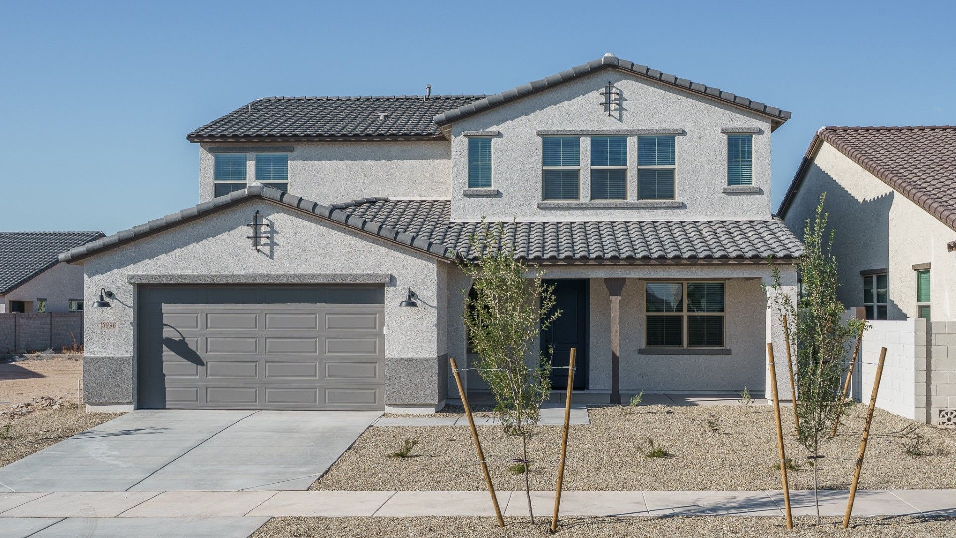 The Grove at El Cidro - Cottonwood Floor Plan - Front Exterior:cottonwood spanish elevation new homes for sale the grove at el cidro goodyear az william ryan