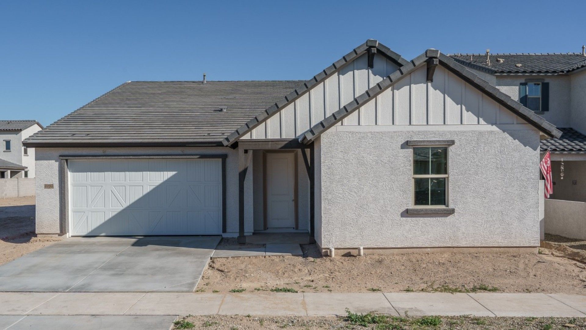 The Grove at El Cidro - Juniper Floorplan - Front Exterior:juniper farmhouse elevation new homes for sale the grove at el cidro goodyear az william ryan