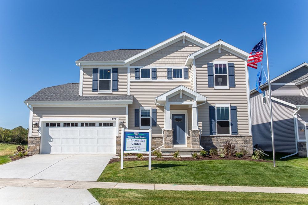 Woods Farm Fordham II model home front exterior lawn view new homes for sale in Wisconsin William...