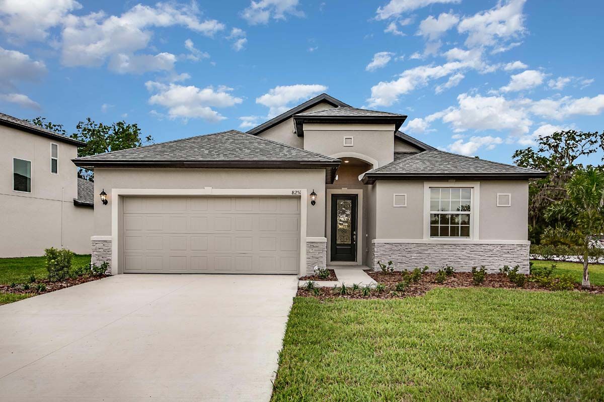 Sanibel Tuscan Elevation with Optional Stone:Sanibel new construction home plan at Tea Olive Terrace by William Ryan Homes Tampa